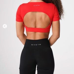 NVGTN NWOT size M red open back fee. Never worn.